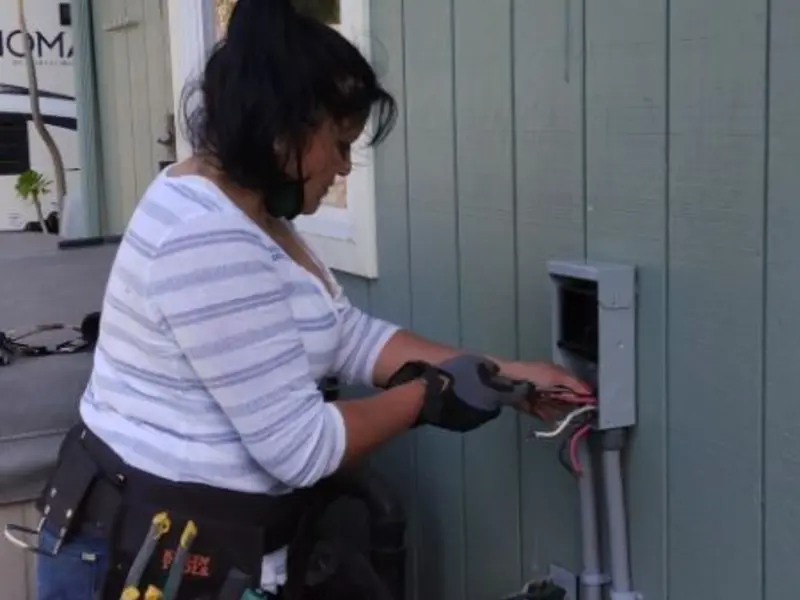 Licensed electrician wiring an exterior subpanel in West Pikeland